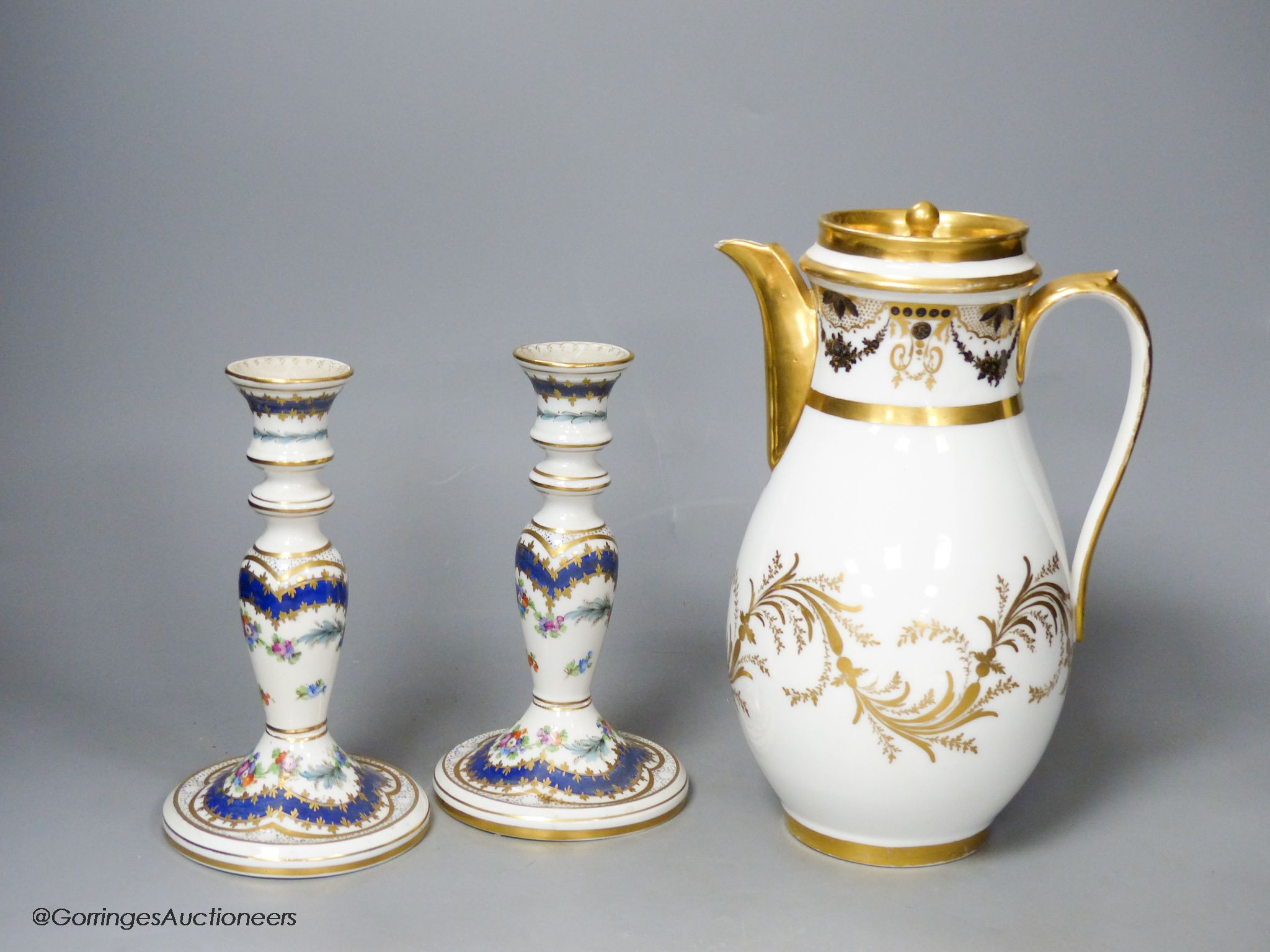 A 19th century Paris porcelain coffee pot and a pair of Dresden candlesticks, tallest 24cm